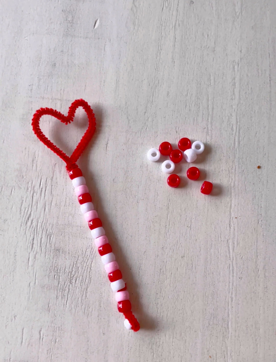 valentine's day bead activity heart wand craft made of a pipecleaner and pony beads